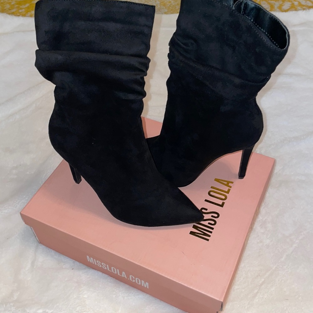 Black suede ankle height, heeled boots